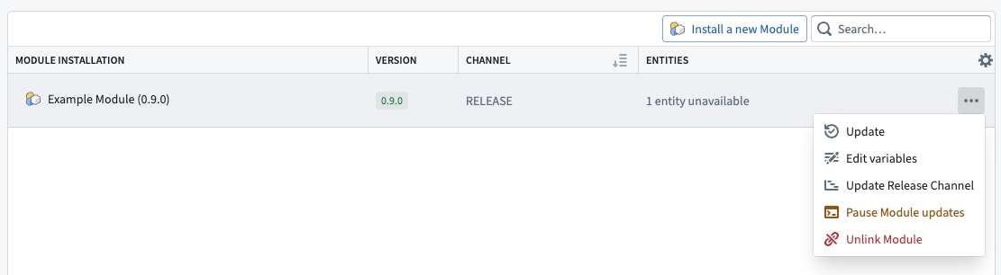 The pause module updates action is available from the Module installation dropdown menu.