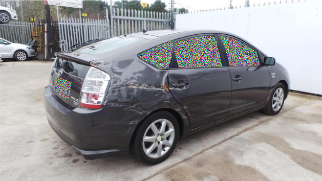 Users can apply the visual obfuscation algorithm to obscure potentially sensitive regions of an image. Image source: Car Parts and Car Damages - https://www.kaggle.com/datasets/humansintheloop/car-parts-and-car-damages provided under a CC0 license.