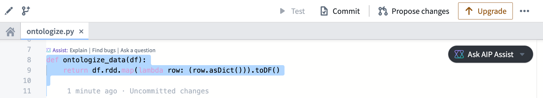 A highlighted code snippet and the available AIP Assist inline code assistance options.